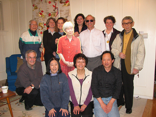Writer-in-residence John Asfour with a picture of Joy Kogawa and board members of the Historic Joy Kogawa House Society